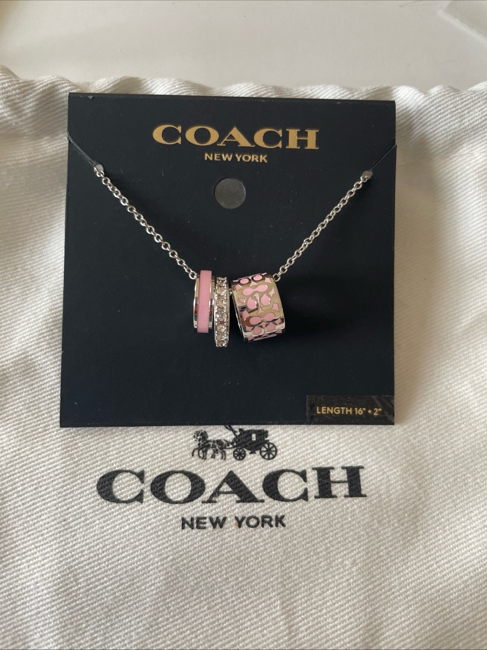 Coach Silver-Tone Necklace with Pink Enamel Charm Rings